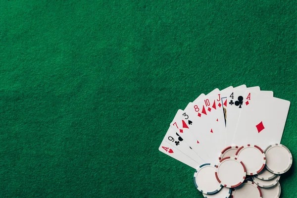 Live blackjack dealer at aska studio with cards and chips visible